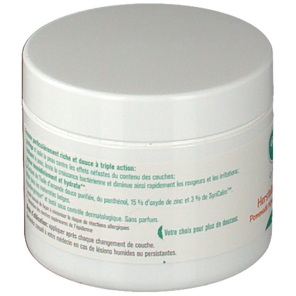 Pot rond blanc avec couvercle. Texte sur l'étiquette concernant les ingrédients et les effets du produit.