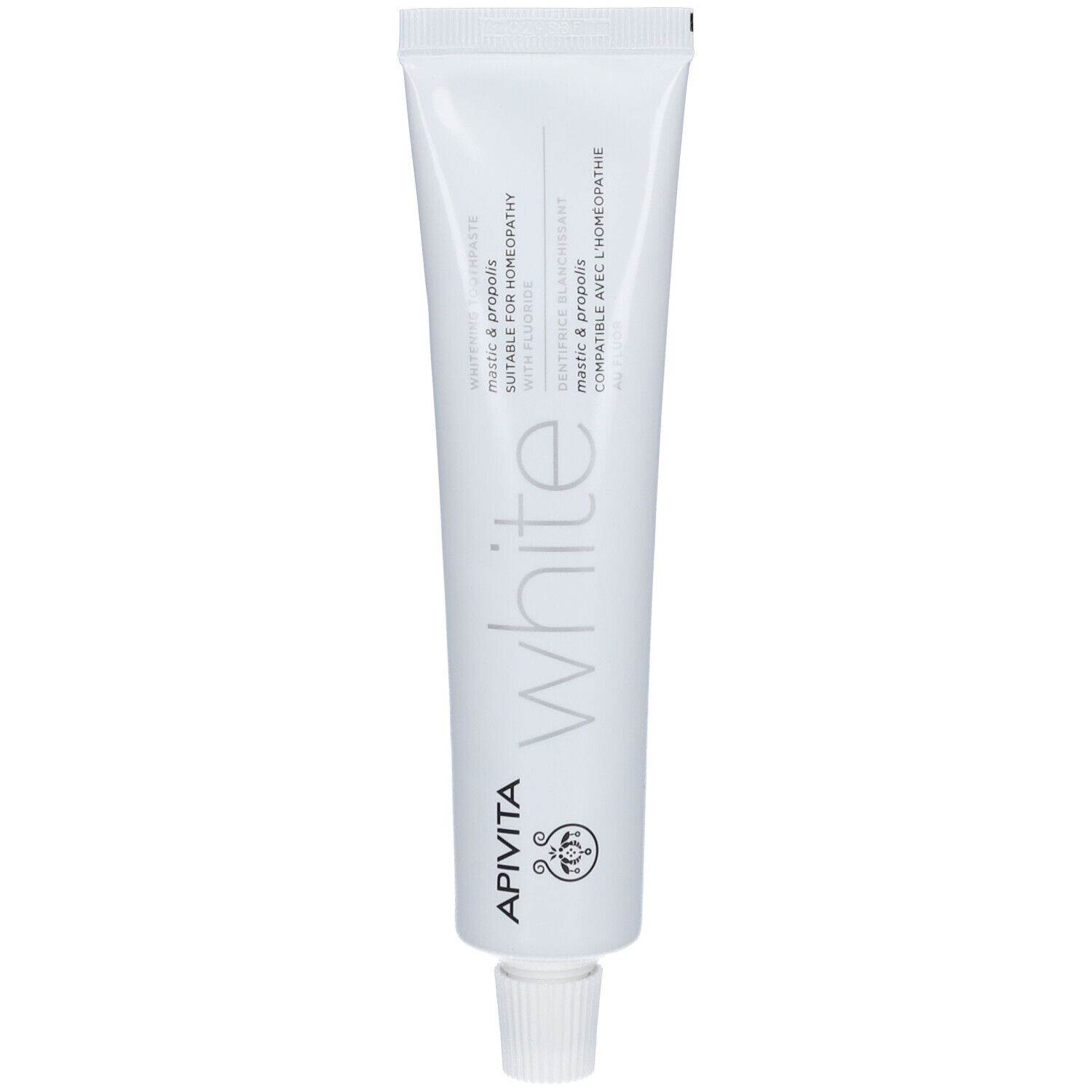 Tube blanc avec inscription APIVITA et mention "white". Contient Mastic & Propolis, compatible avec l'homéopathie.