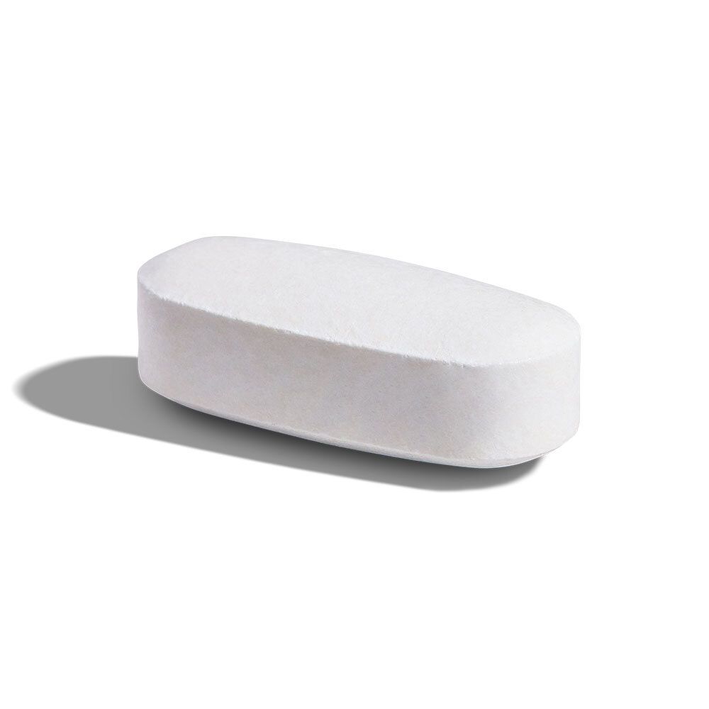 Un comprimé blanc ovale unique. Repose sur une surface avec une ombre.