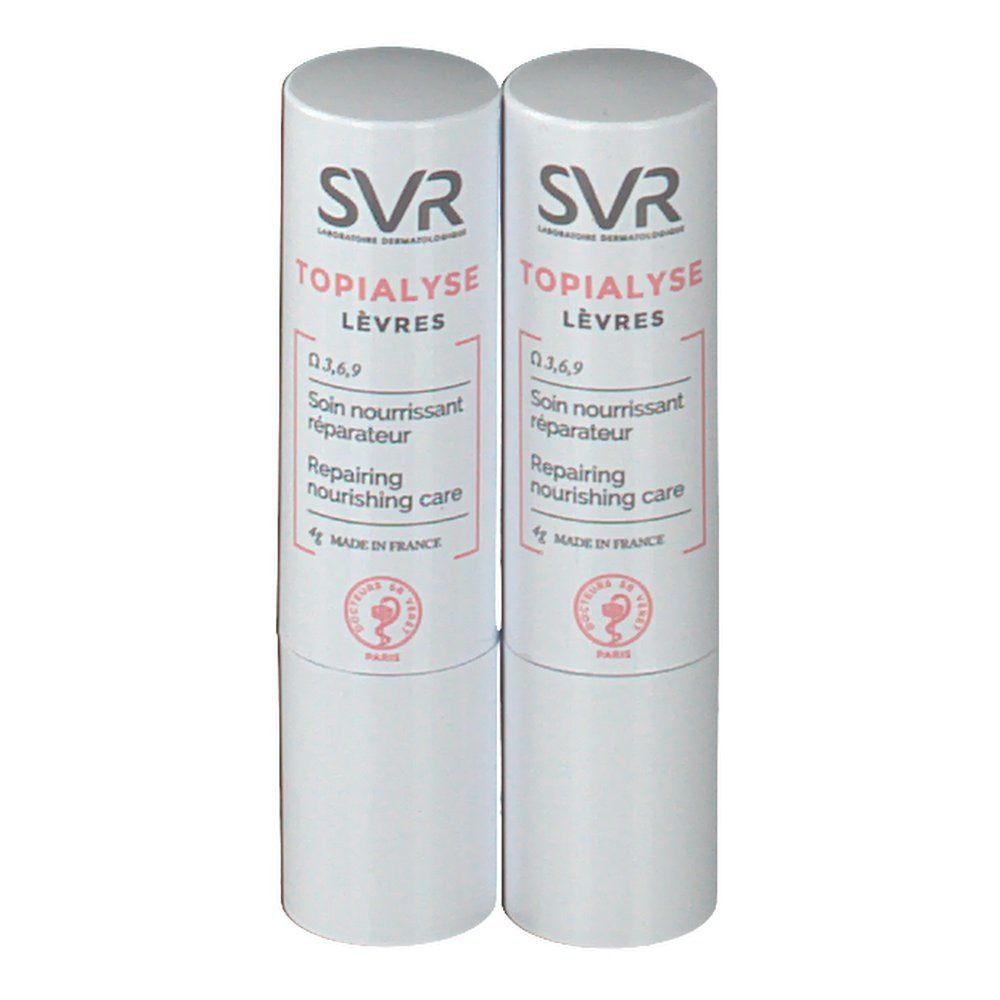Deux sticks à lèvres blancs. Inscription: SVR Topialyse Lèvres, Soin nourrissant réparateur, Repairing nourishing care.