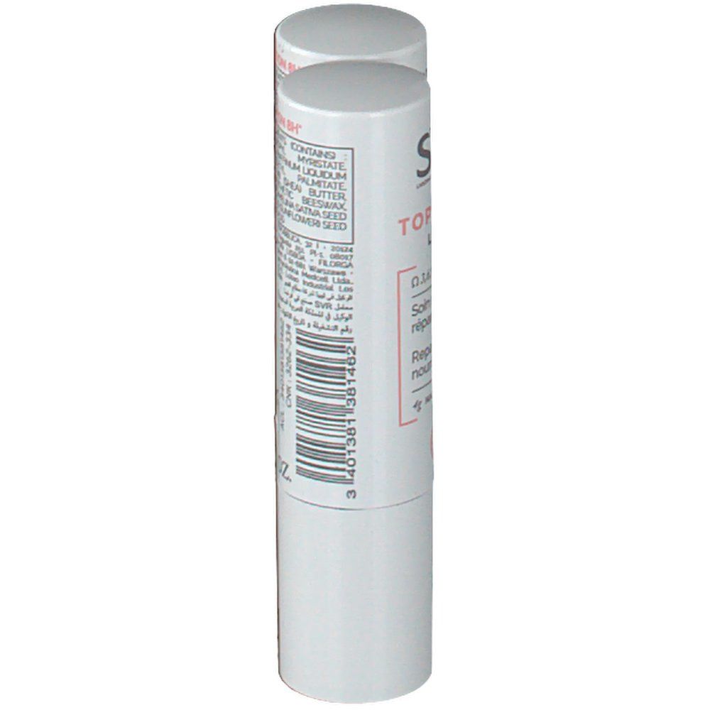 Un stick à lèvres blanc. Dos avec ingrédients et code-barres. Inscription: 0.14 FL.OZ.