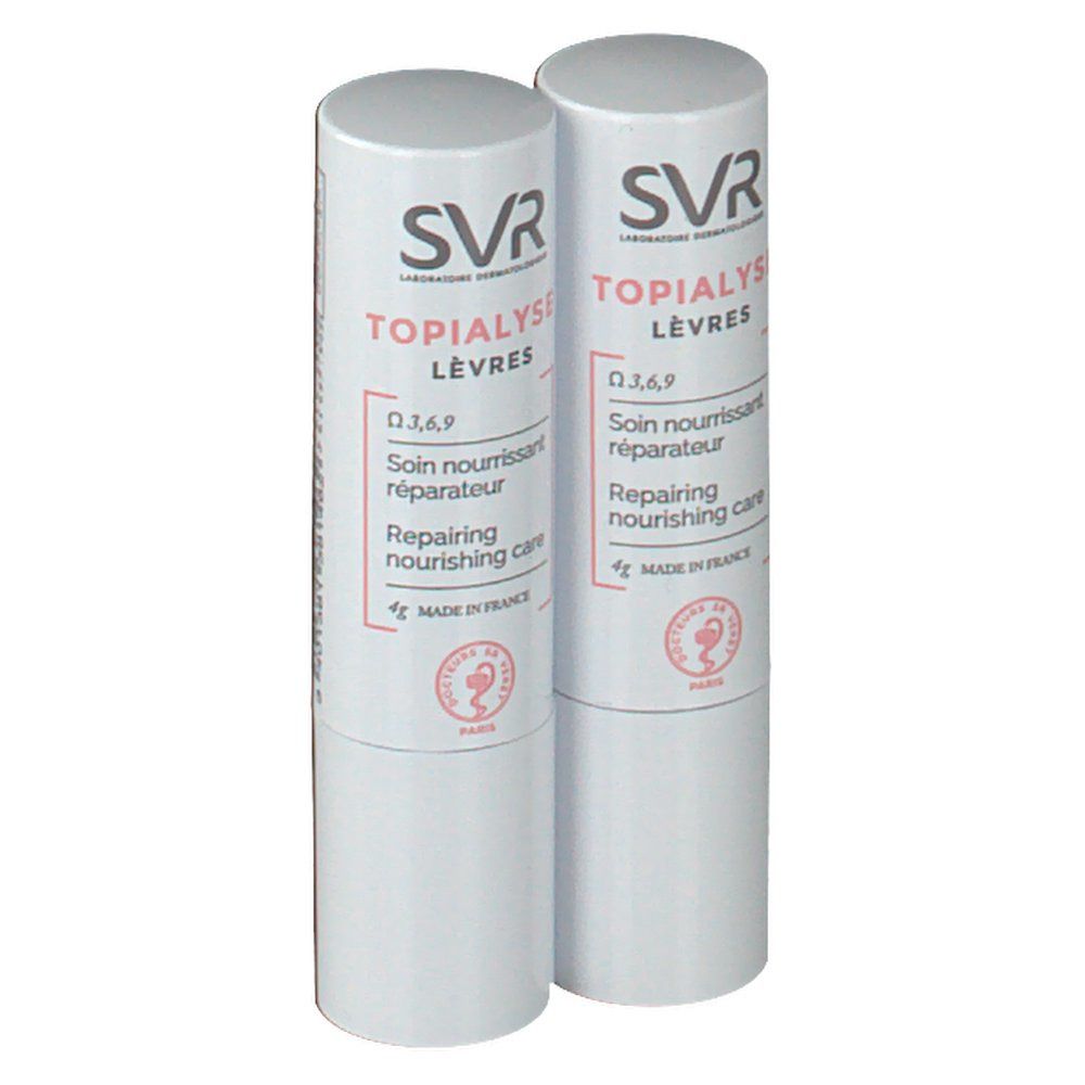 Deux sticks à lèvres blancs. Inscription: SVR Topialyse Lèvres, Soin nourrissant réparateur, Repairing nourishing care.