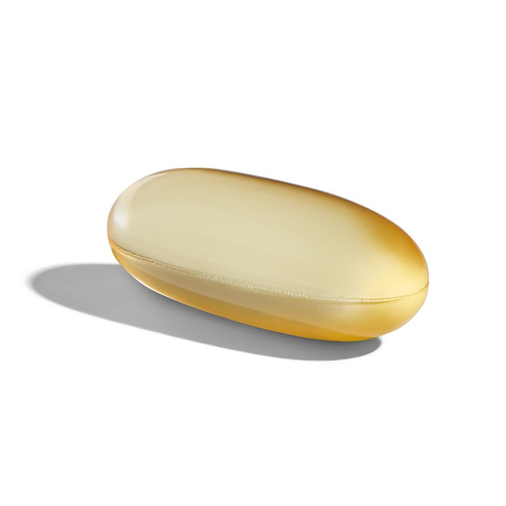 Gélule ovale jaune. Ombre portée sur fond blanc.