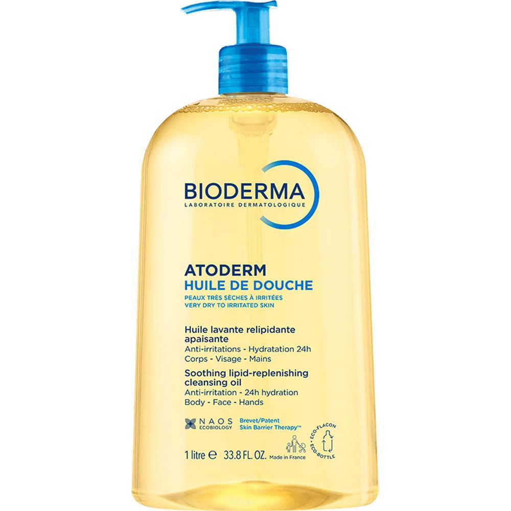 Flacon BIODERMA Atoderm Huile de douche. Liquide jaune, pompe bleue. Inscription : Atoderm, Huile de douche.