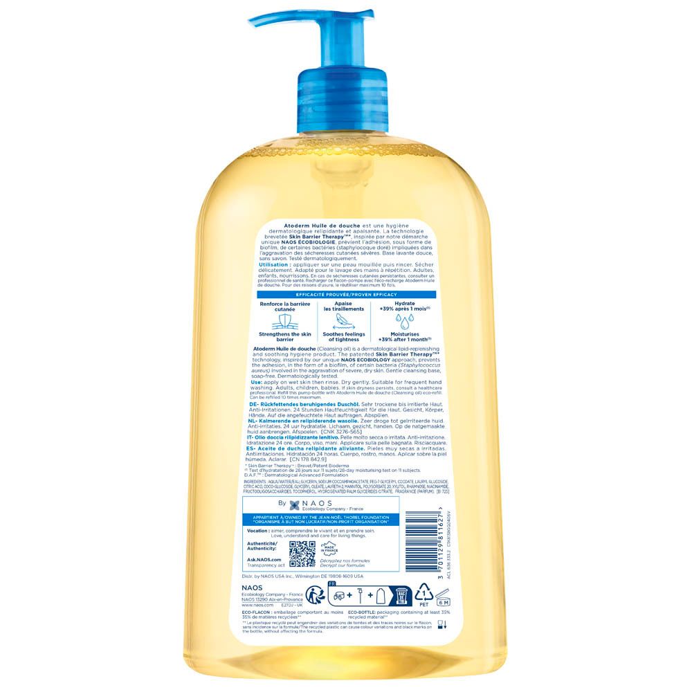 Dos du flacon BIODERMA Atoderm Huile de douche. Texte et code-barres. Inscriptions bleues et blanches sur fond transparent.
