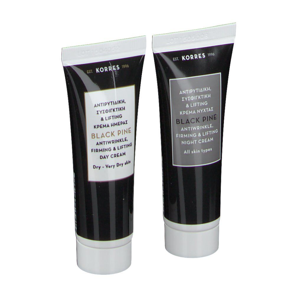 Deux tubes de crème KORRES Black Pine jour et nuit. Tubes noirs avec texte blanc. Crème de jour pour peaux sèches, crème de nuit pour tous types de peau.
