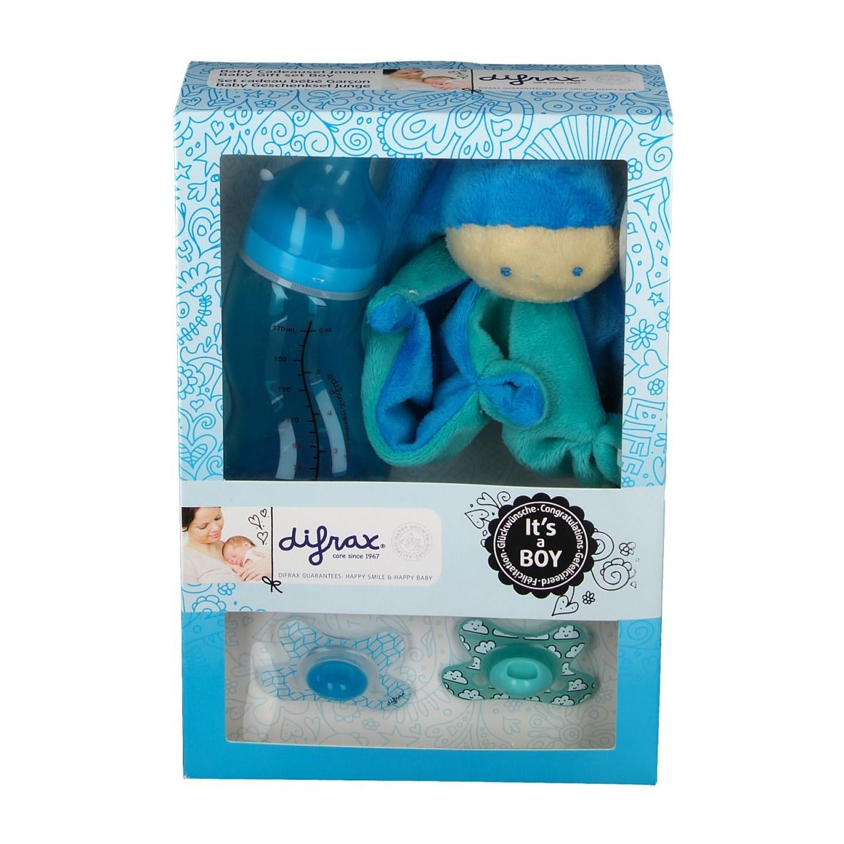 Coffret cadeau avec biberon, sucettes et peluche. Marque : Difrax. Inscription "It's a Boy". Contenu visible.