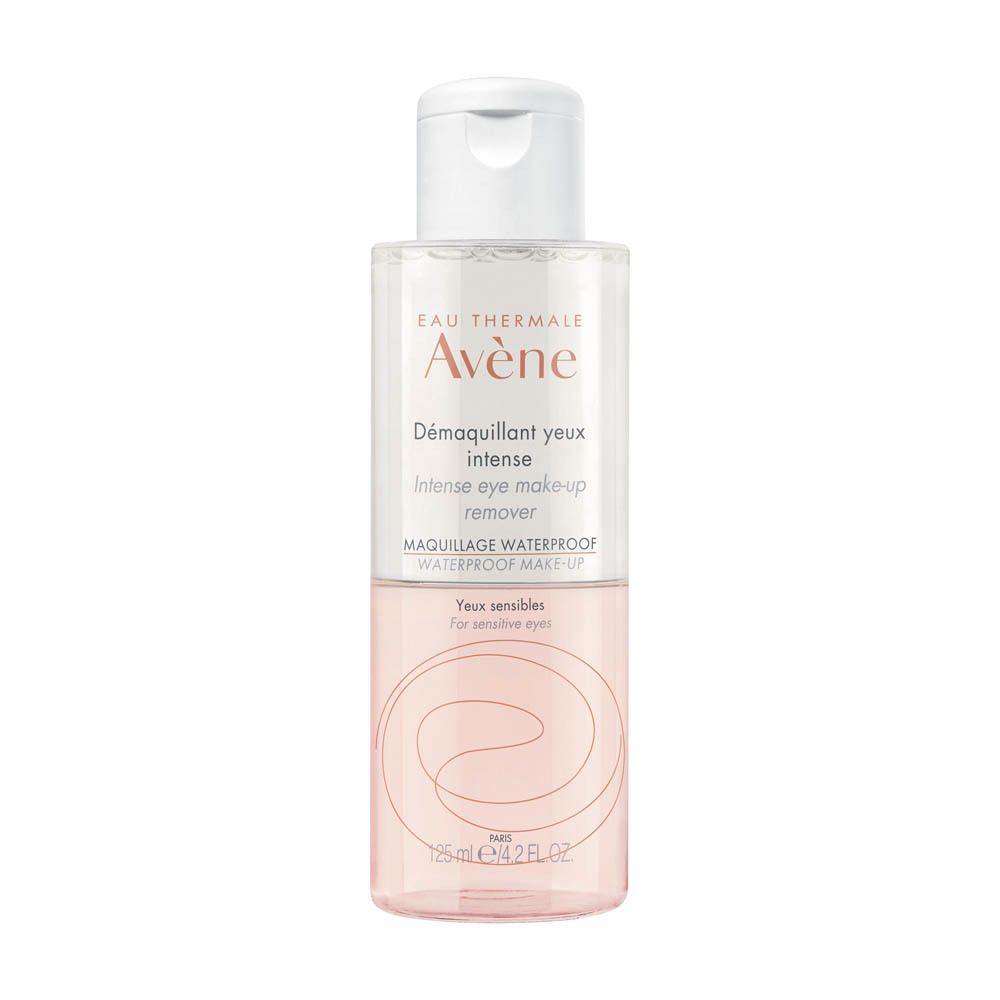 Flacon transparent Avène Démaquillant yeux intense, bouchon blanc. Liquide rose. Texte: Intense eye make-up remover.