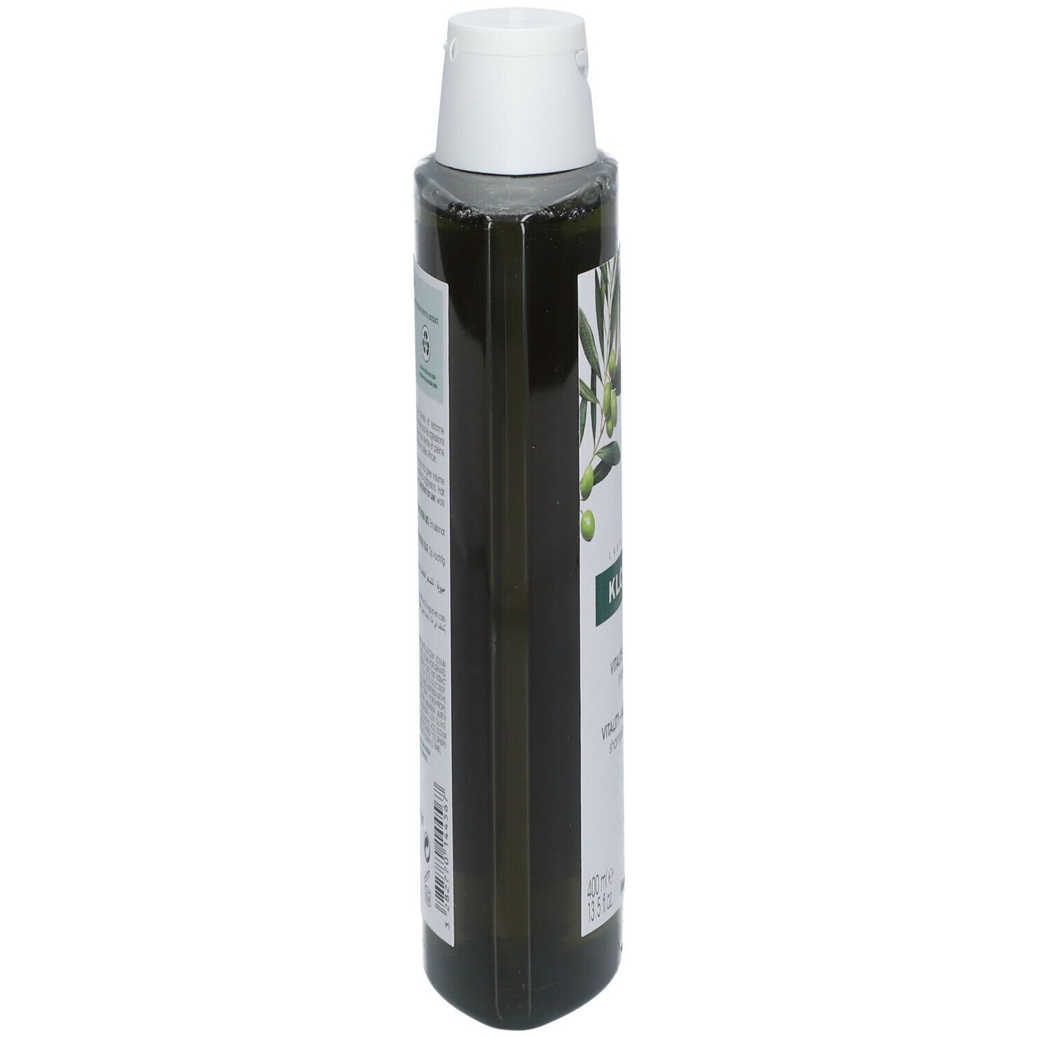 Vue étroite d'un flacon de shampooing vert avec bouchon blanc. Étiquette avec texte et illustration d'olives.