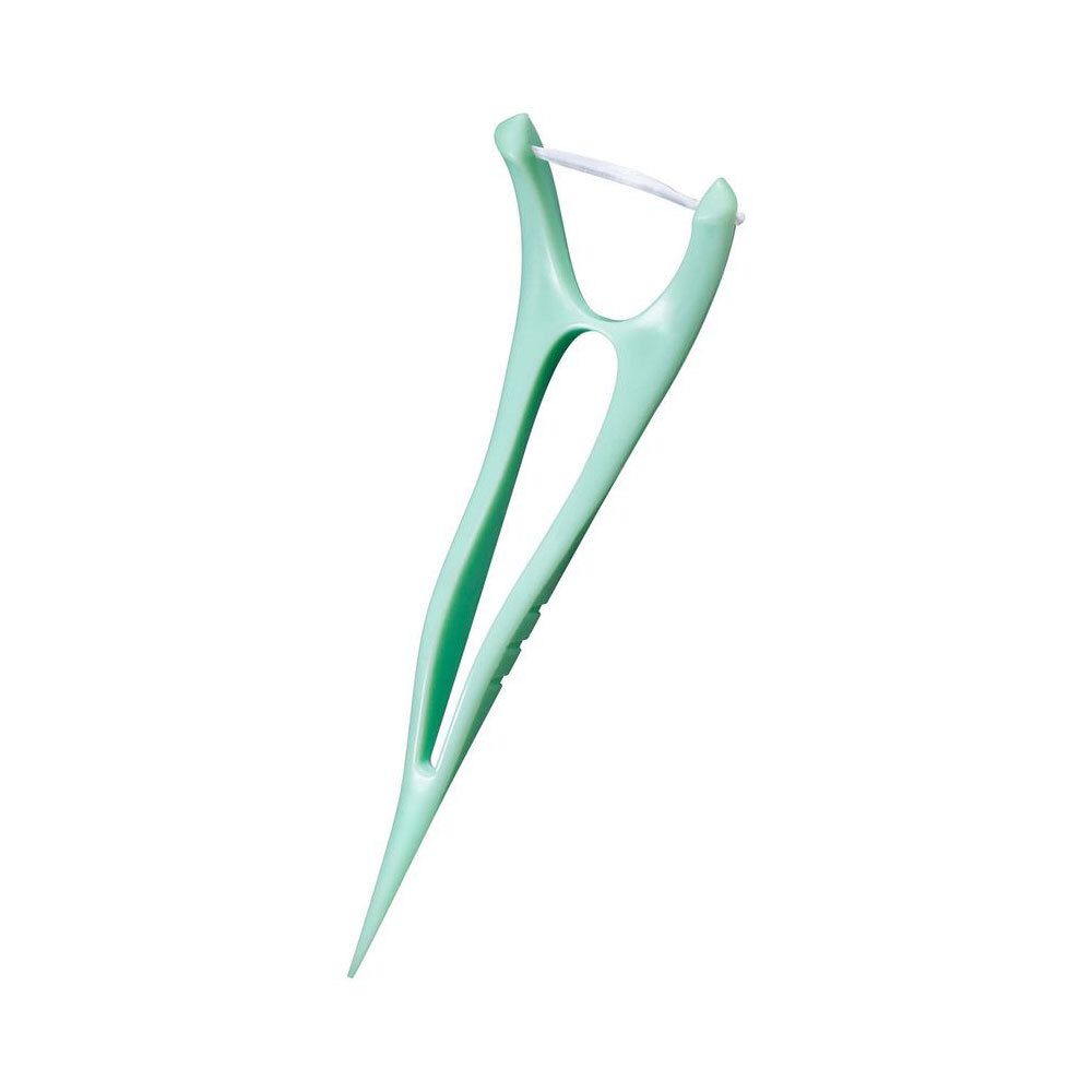 Flosser individuel. Plastique verdâtre, forme en Y. Avec fil dentaire.