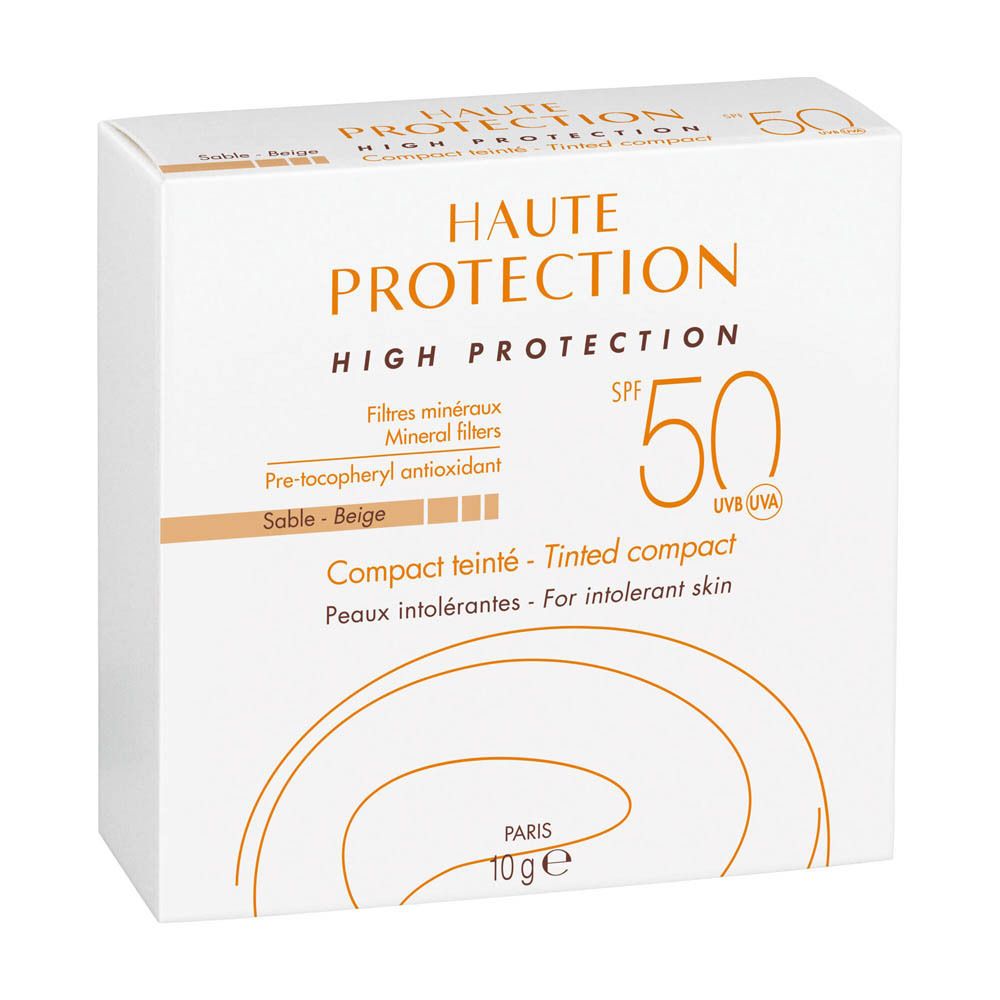 Emballage blanc avec écriture orange. Texte : HAUTE PROTECTION, SPF 50, Compact teinté.