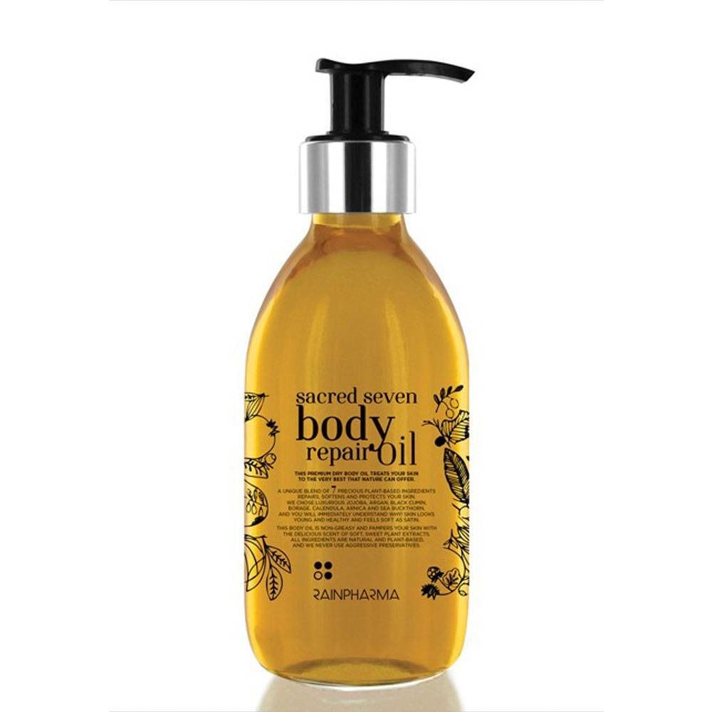 Flacon jaune avec pompe noire. Inscription "sacred seven body repair oil" et "Rainpharma".