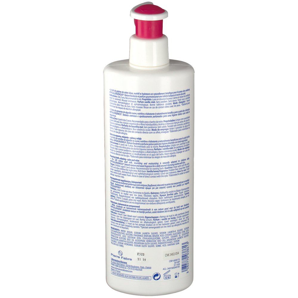 Dos d'un flacon blanc avec pompe rose. Texte en plusieurs langues. Inscription : Klorane. Informations sur le produit.