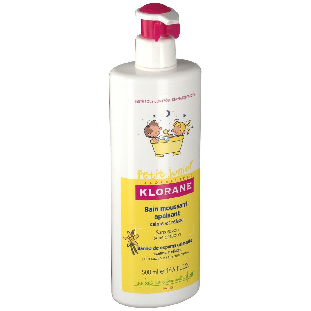 Flacon blanc avec pompe rose. Étiquette jaune avec texte et illustrations. Inscription : Klorane Petit Junior, bain moussant apaisant.
