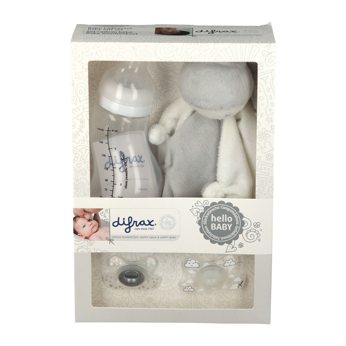 Coffret cadeau avec biberon, sucettes et peluche. Emballage avec fenêtre. Marque difrax®.
