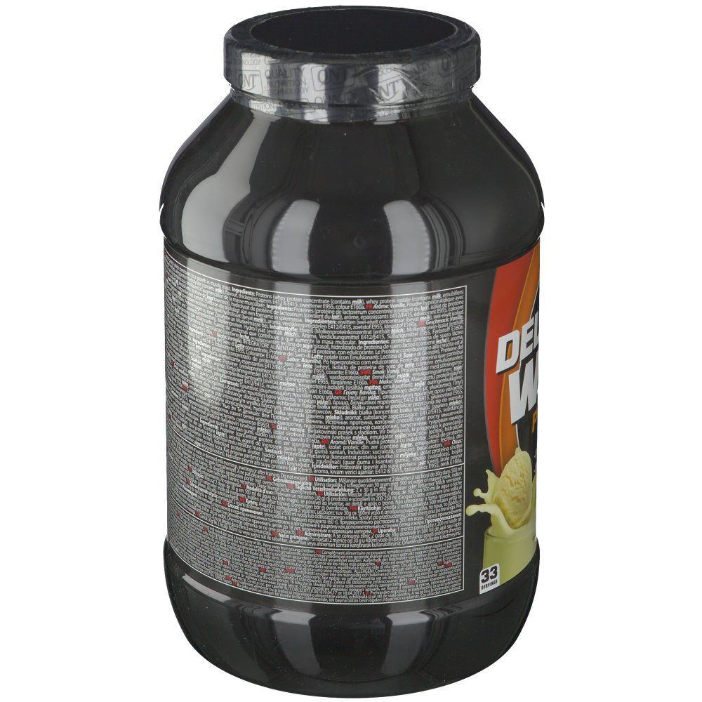 Dos du pot noir QNT Delicious Whey Protein. Texte multilingue. Couvercle noir. Bande orange.