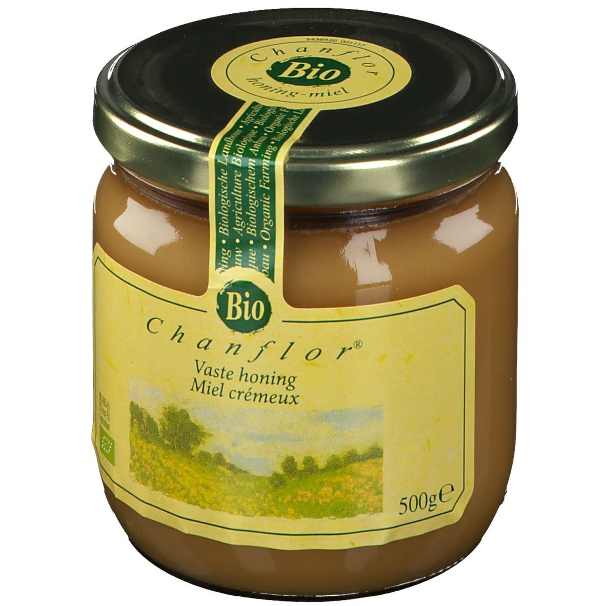 Pot de miel avec couvercle. Étiquette avec "Chanflor", "Bio" et paysage. Inscription "Vaste honing Miel crémeux".
