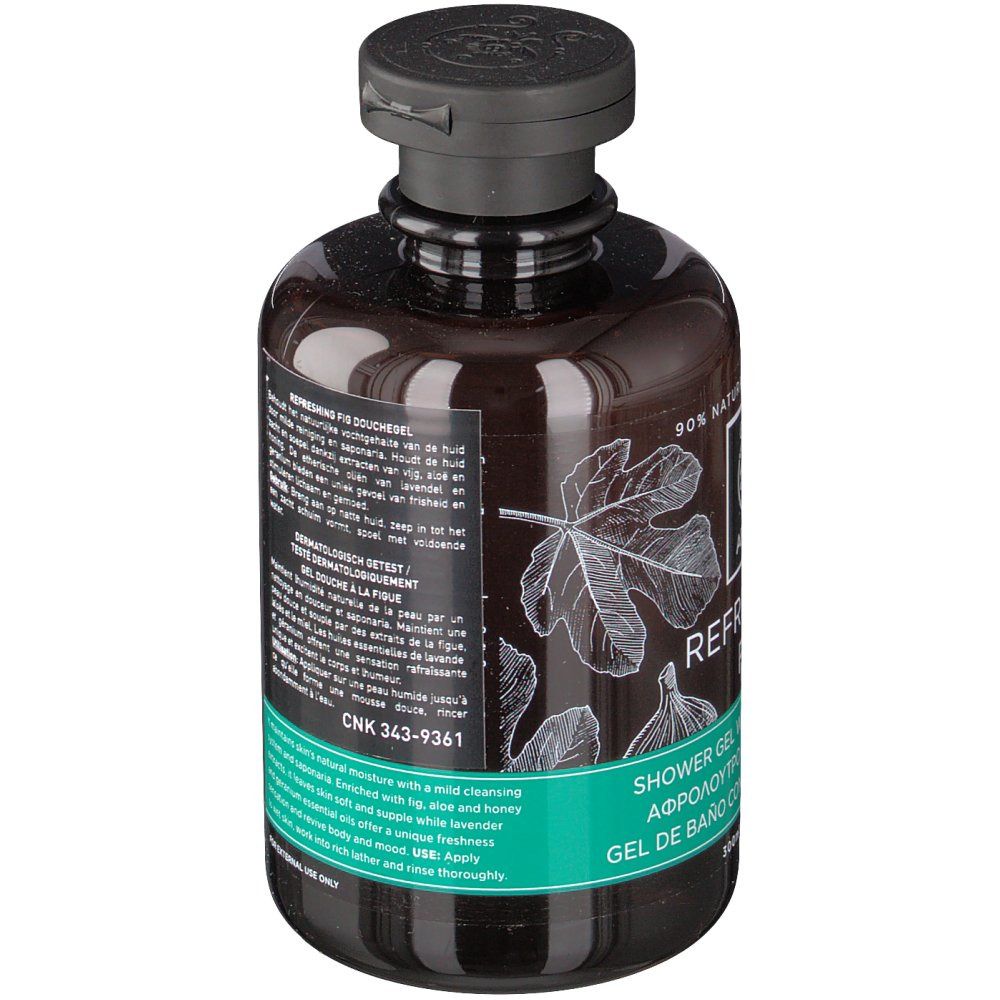 Flacon brun avec bouchon noir. Étiquette avec nom du produit, illustrations de figues et texte. Texte multilingue visible.