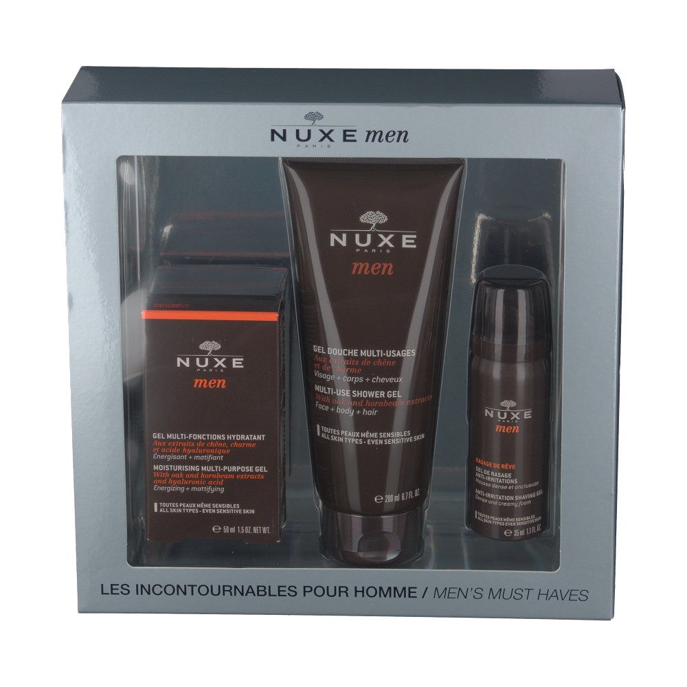 Coffret cadeau NUXE Men avec gel hydratant, gel douche et déodorant. Emballage gris avec produits bruns. Logo NUXE Men visible.
