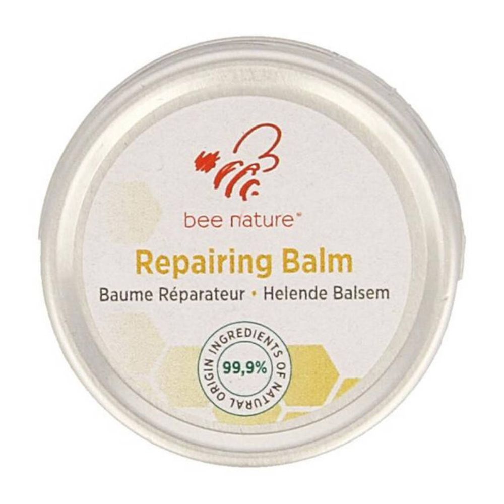 Pot rond avec couvercle. Inscription: bee nature® Baume Réparateur. Texte en allemand, français et néerlandais. Sceau: 99,9% ingrédients naturels.