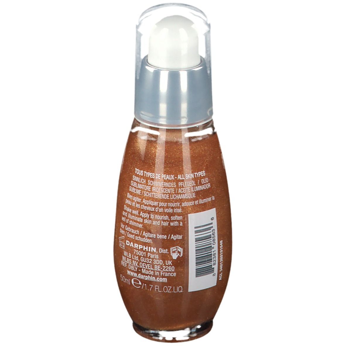 Vue arrière du flacon d'huile. Bouchon transparent, col argenté, huile brune. Texte: Tous types de peaux, 50ml, Agiter avant usage.