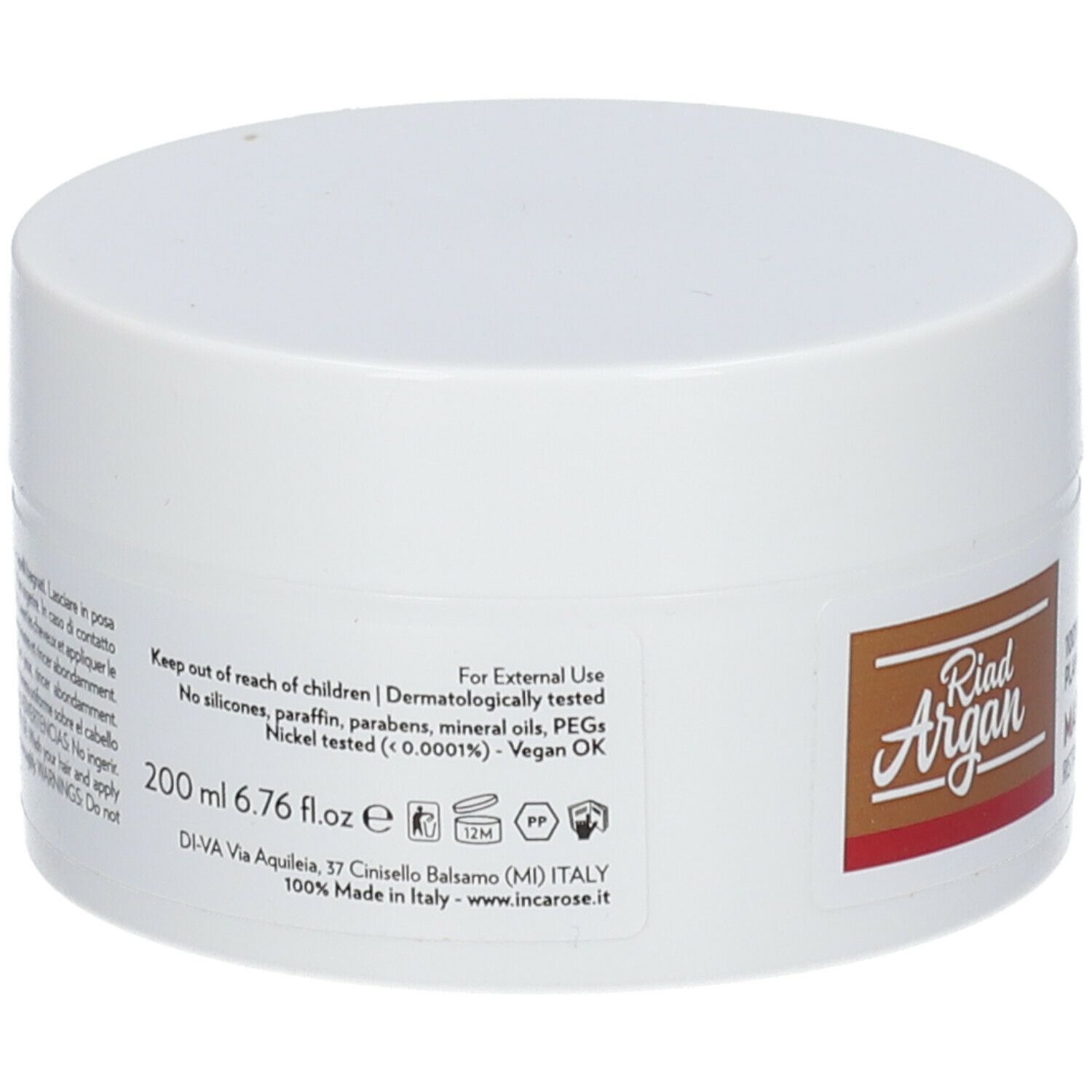 Pot blanc avec couvercle. Inscription: Riad Argan. Texte multilingue. 200 ml. Vegan OK. Testé dermatologiquement.