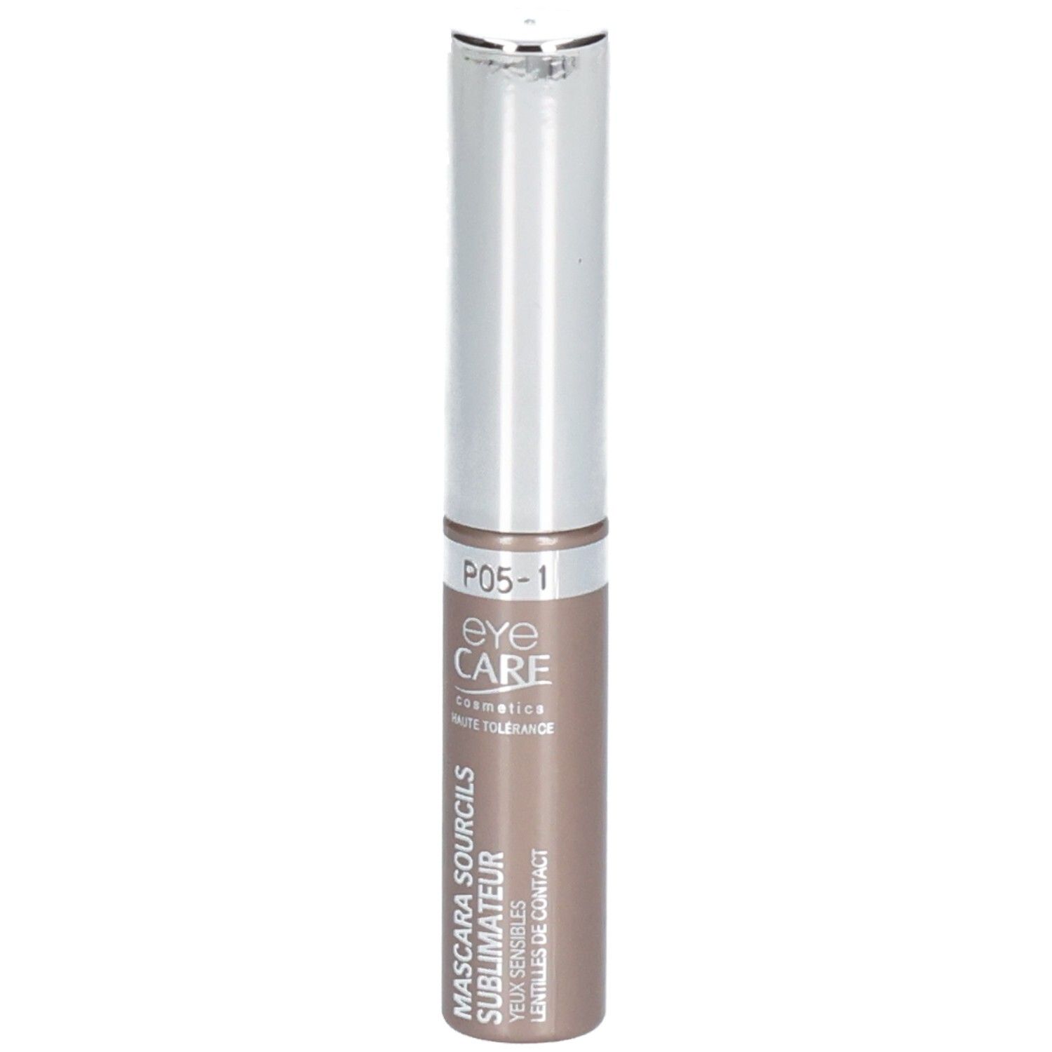 Mascara sourcils brun. Tube cylindrique avec capuchon argenté. Nom du produit et marque visibles.