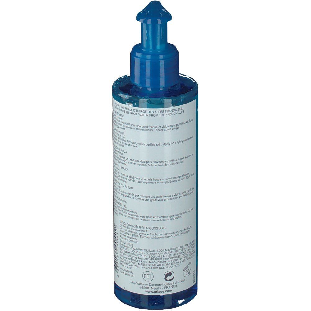 Dos du flacon bleu avec pompe doseuse. Texte multilingue. Inscription: Laboratoire Dermatologique Uriage.