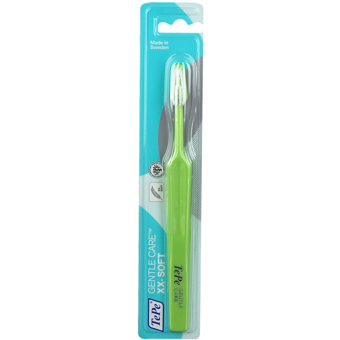 Brosse à dents emballée. Manche vert, tête blanche. Texte: TePe GENTLE CARE XX-SOFT.