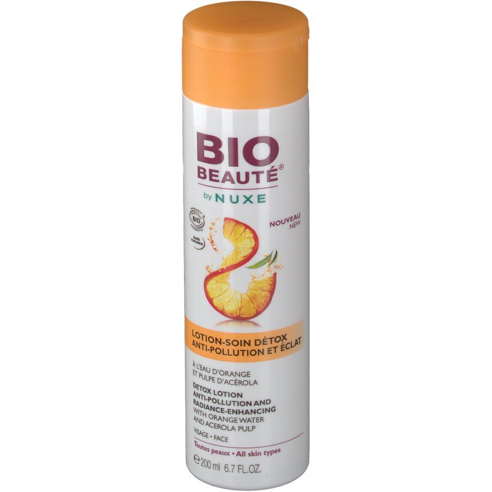 Flacon blanc avec bouchon orange. Inscription: BIO BEAUTÉ by NUXE. Lotion-soin détox. À l'eau d'orange et pulpe d'acérola.