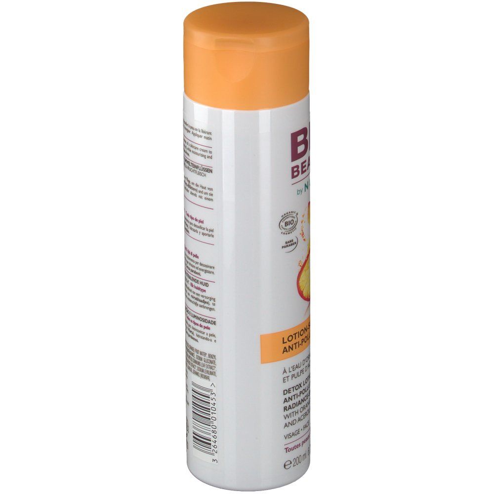 Flacon blanc avec bouchon orange. Inscription: BIO BEAUTÉ by NUXE. Lotion-soin détox. À l'eau d'orange et pulpe d'acérola.