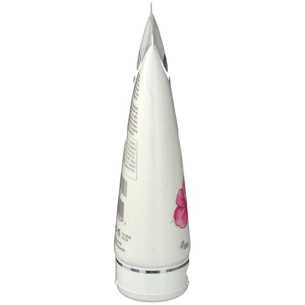 Vue latérale d'un tube blanc. Contient du texte et une illustration d'orchidée.