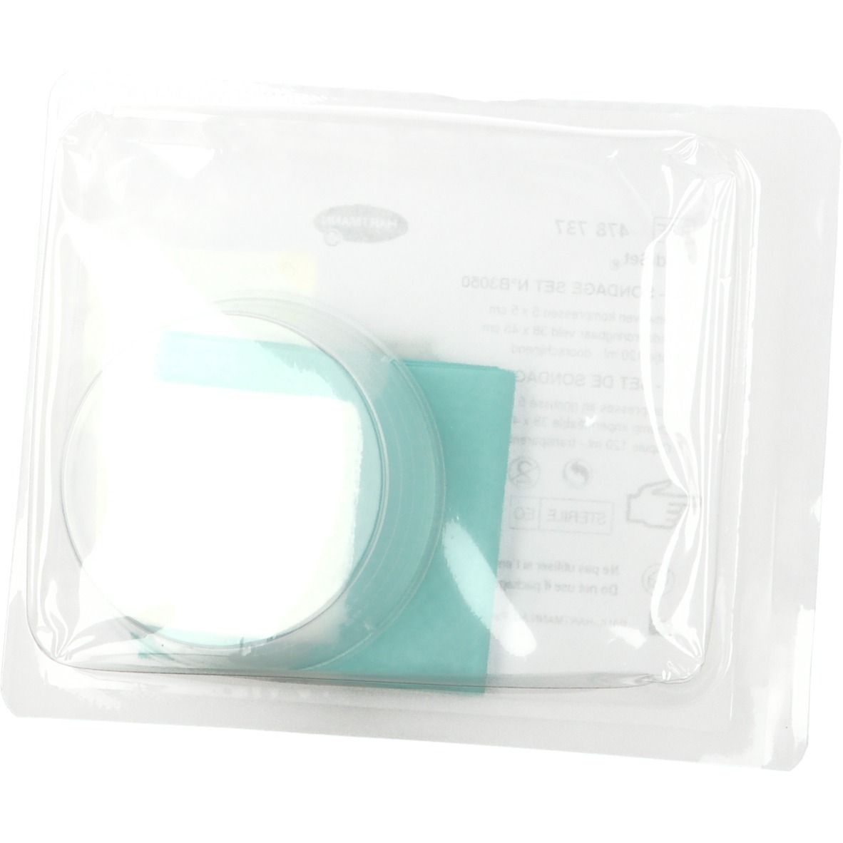 Hartmann MediSet dans un emballage transparent. Compresse ronde et tissu vert visibles.