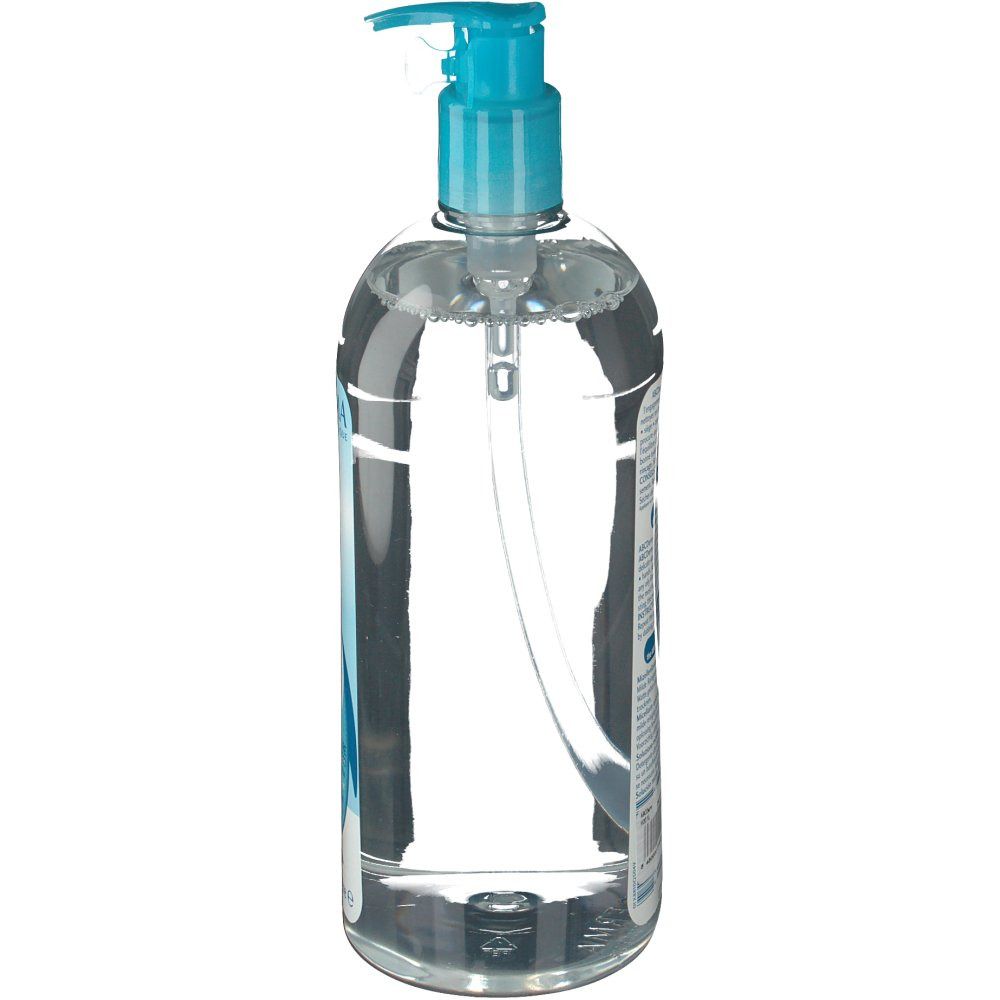 Liquide transparent dans un flacon avec bouchon pompe bleu. Vue latérale, montrant la forme du flacon et le mécanisme de la pompe.