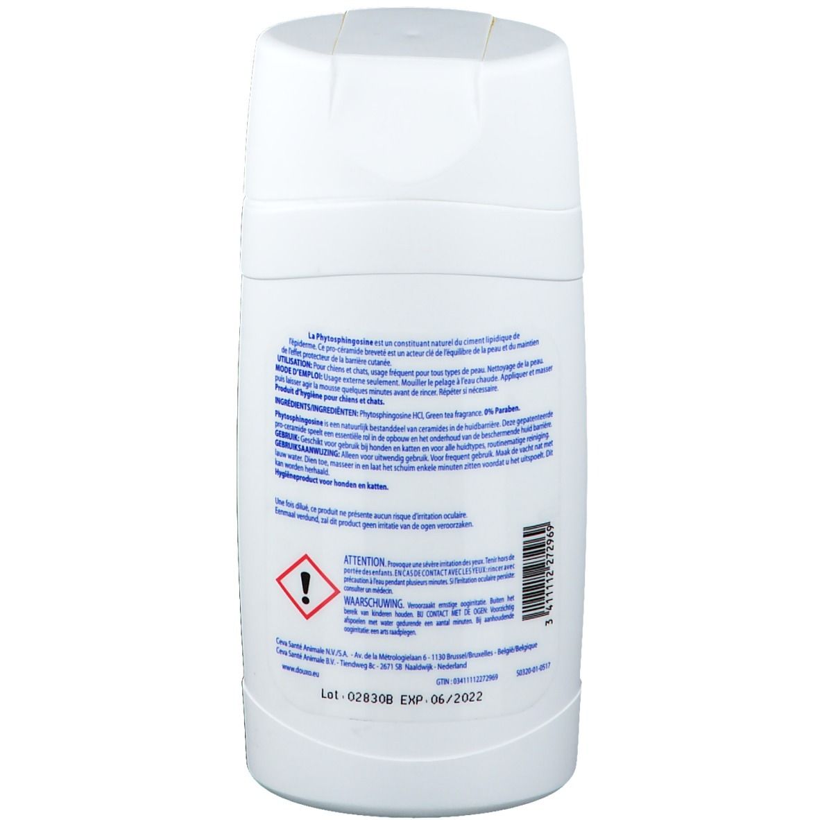 Dos du flacon de shampooing blanc avec texte et symboles d'avertissement. Contient des informations sur le produit.