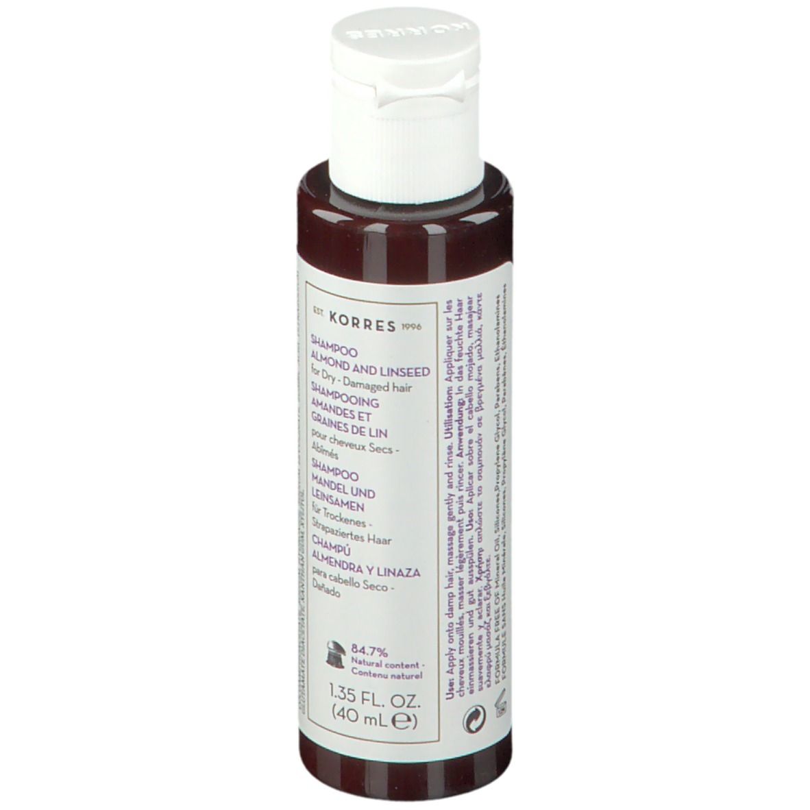 Flacon de shampooing KORRES. Dos avec texte, bouchon blanc. Texte: Amande et lin pour cheveux secs, 84,7% ingrédients naturels.