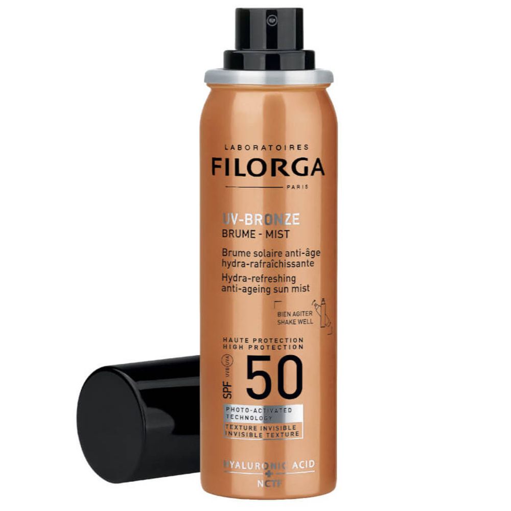 Spray solaire avec bouchon noir. Inscription: UV-Bronze, SPF 50. Marque: Filorga.