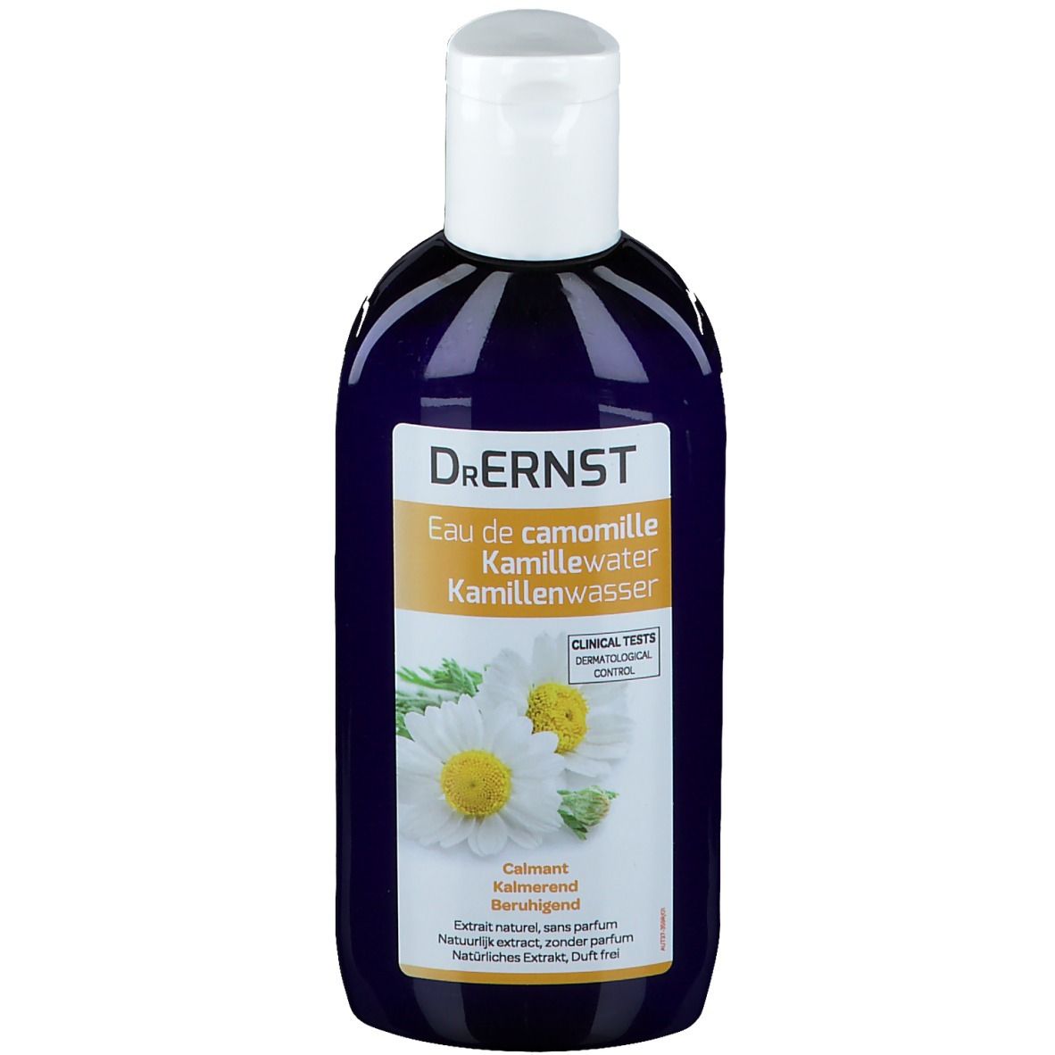 Flacon bleu foncé, bouchon blanc. Inscription: Dr. Ernst, Eau de camomille Kamillenwasser. Étiquette avec fleurs de camomille.