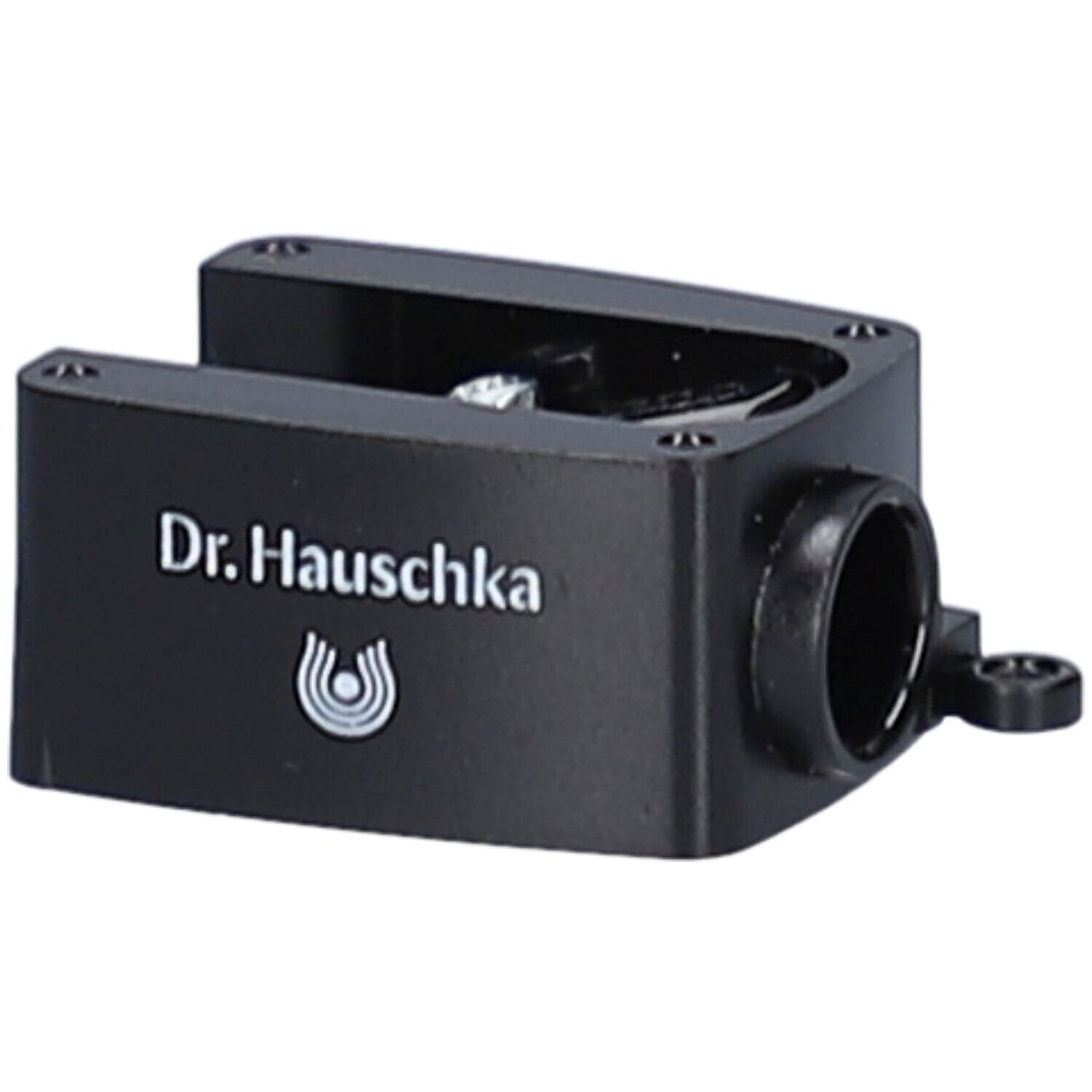 Taille-crayon noir avec le texte Dr. Hauschka et logo. Ouverture latérale.