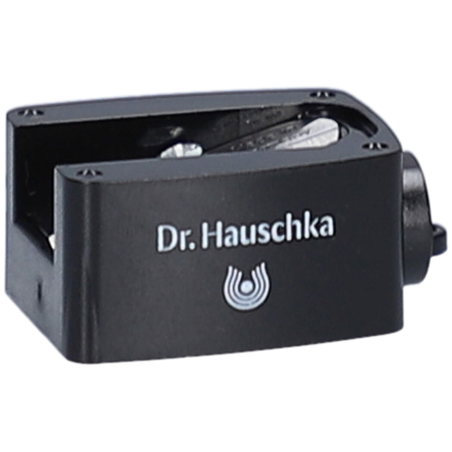 Taille-crayon noir avec le texte Dr. Hauschka et logo. Ouverture latérale.