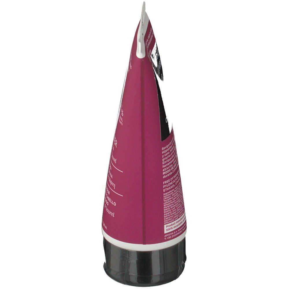 Tube rose. Bouchon noir. Texte sur le côté. Nom du produit illisible.