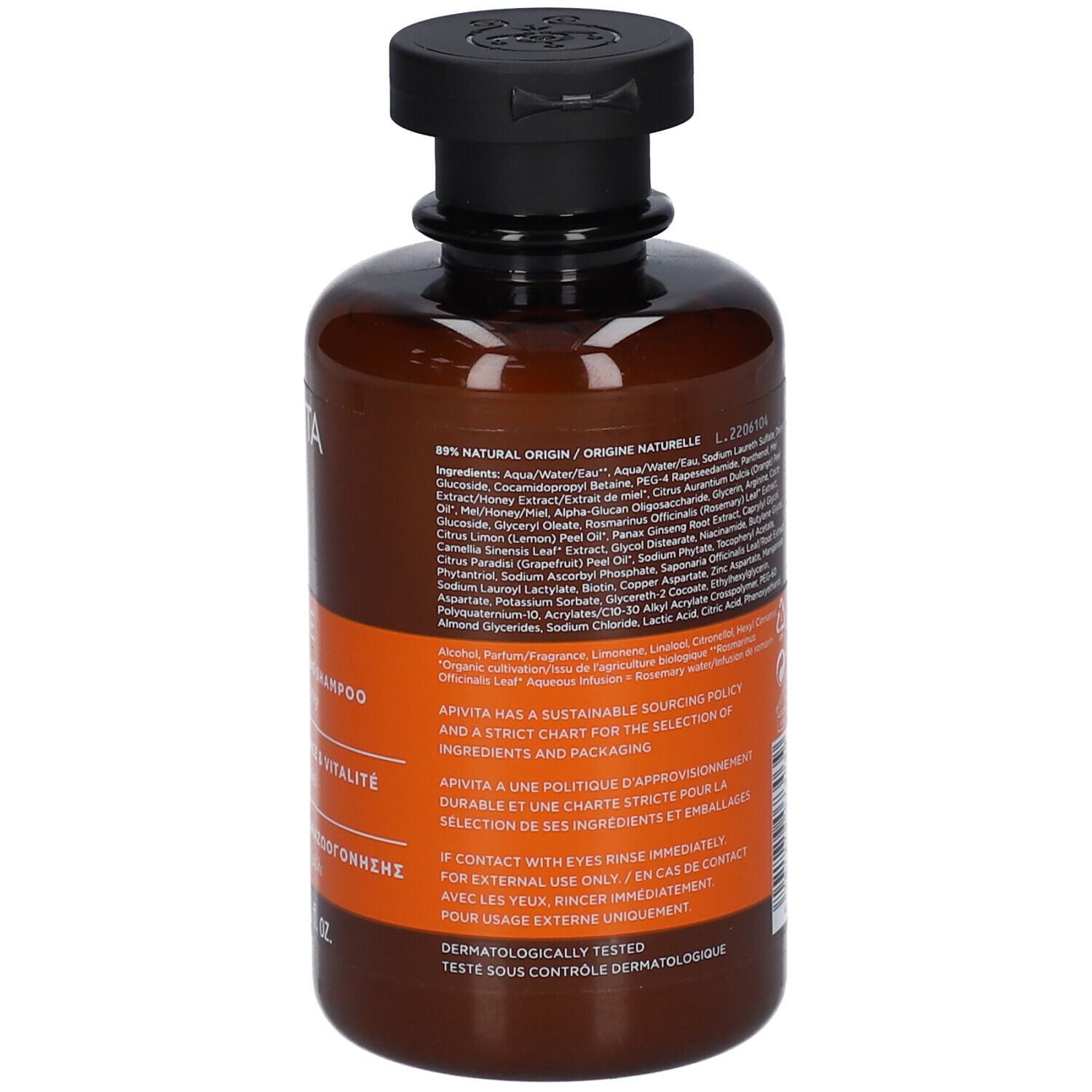Flacon de shampoing brun avec bouchon à rabat noir. Étiquette avec liste des ingrédients et informations produit.