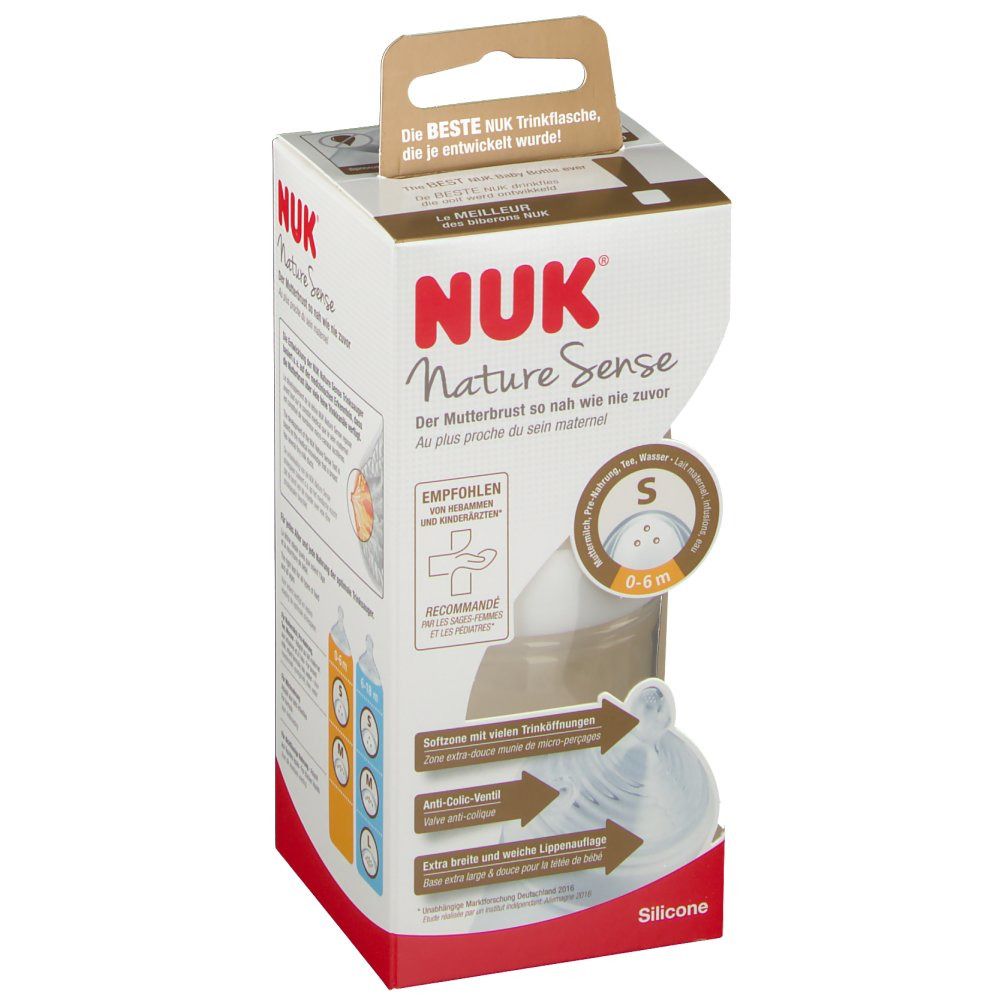 Emballage NUK Nature Sense. Biberon avec tétine en silicone, corps marron et couvercle blanc. Recommandé pour les 0-6 mois.