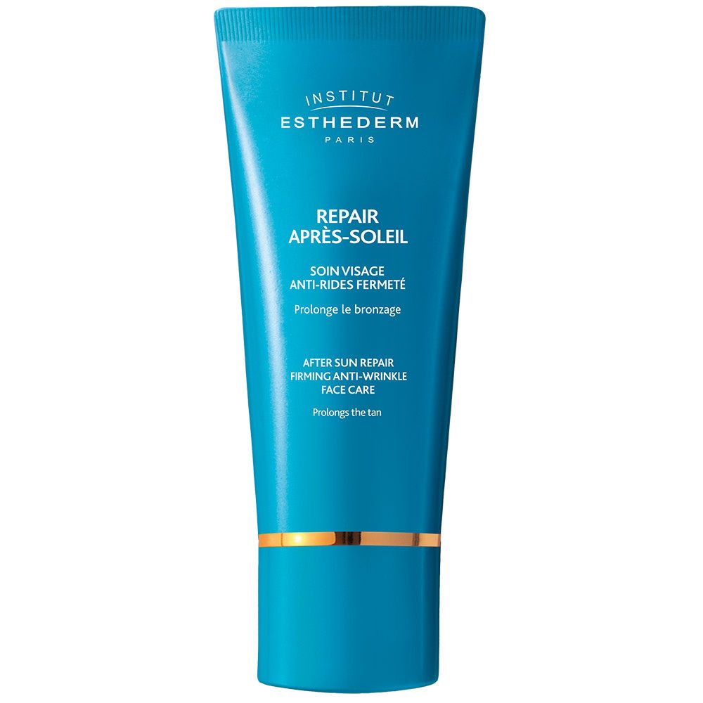 Tube bleu turquoise avec détails dorés. Texte: INSTITUT ESTHEDERM PARIS, REPAIR APRÈS-SOLEIL, SOIN VISAGE.