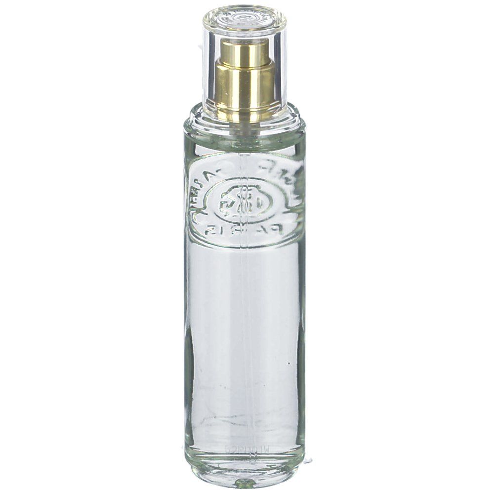 Flacon cylindrique en verre avec vaporisateur. Transparent, avec vaporisateur doré et capuchon transparent. Logo en relief sur le devant.