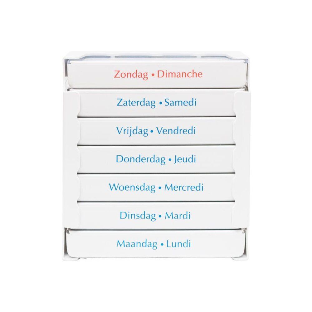 Pilulier blanc à sept compartiments. Inscriptions: Zondag, Zaterdag, Vrijdag, Donderdag, Woensdag, Dinsdag, Maandag. Bilingue.