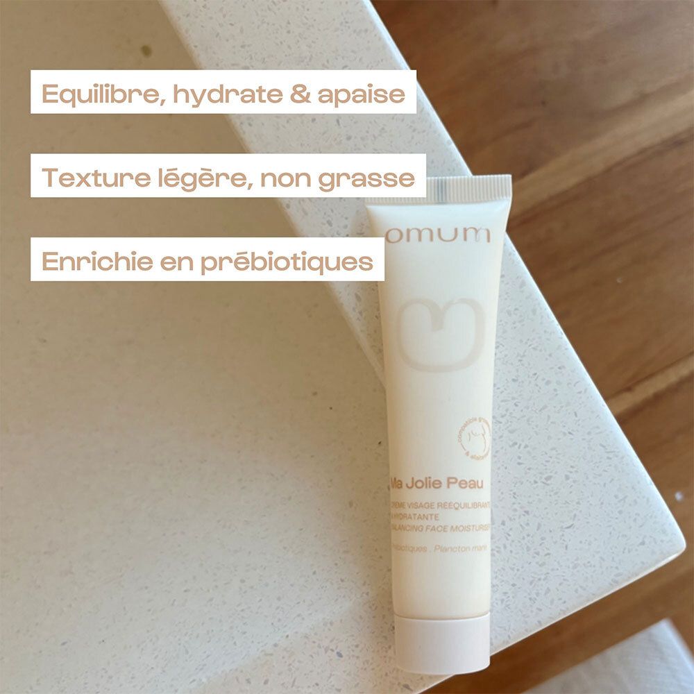 Tube de crème. Texte : Équilibre, hydrate & apaise. Texture légère, non grasse. Enrichie en prébiotiques.