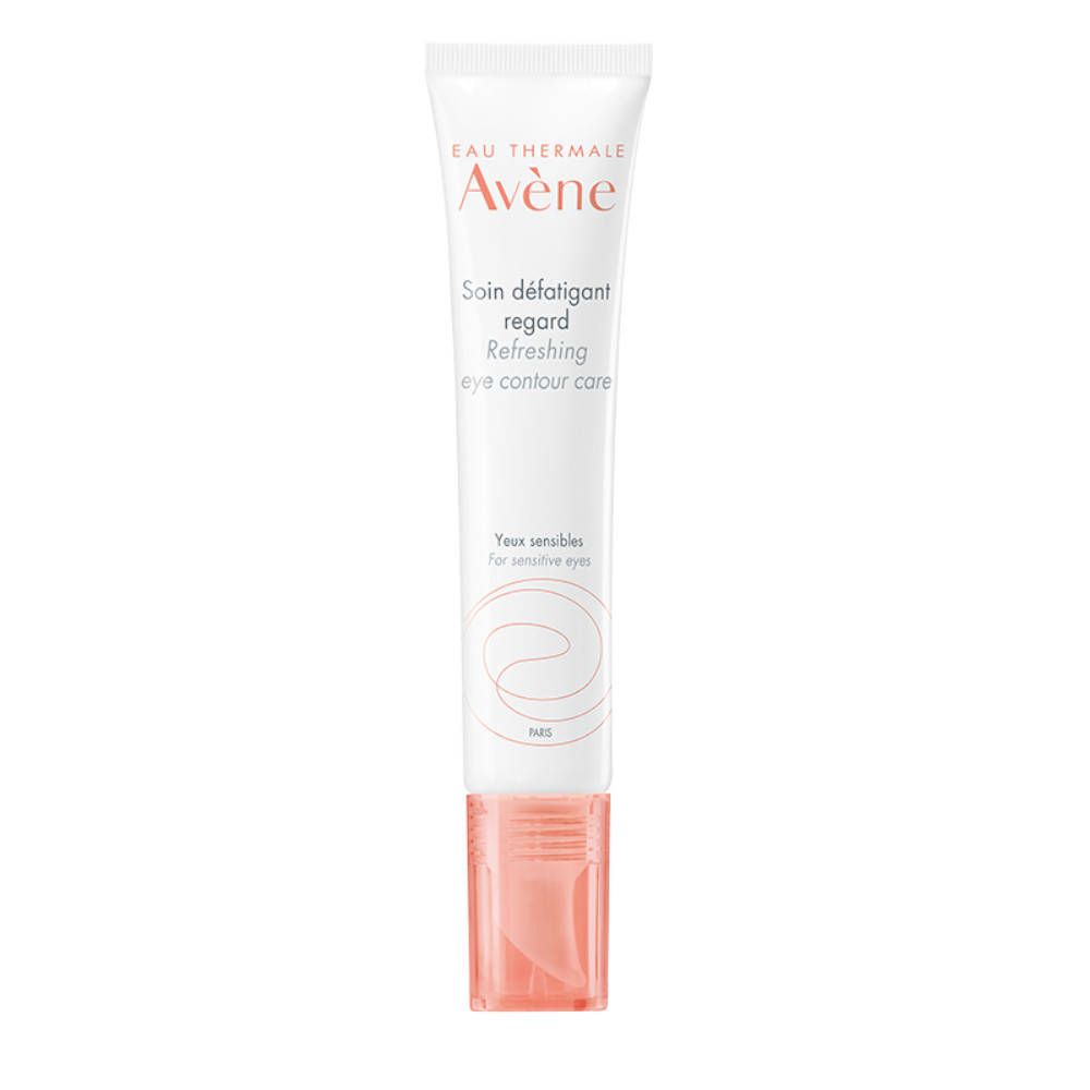 Tube blanc avec bouchon rose. Inscription: Eau Thermale Avène, Soin défatigant regard, Refreshing eye contour care.