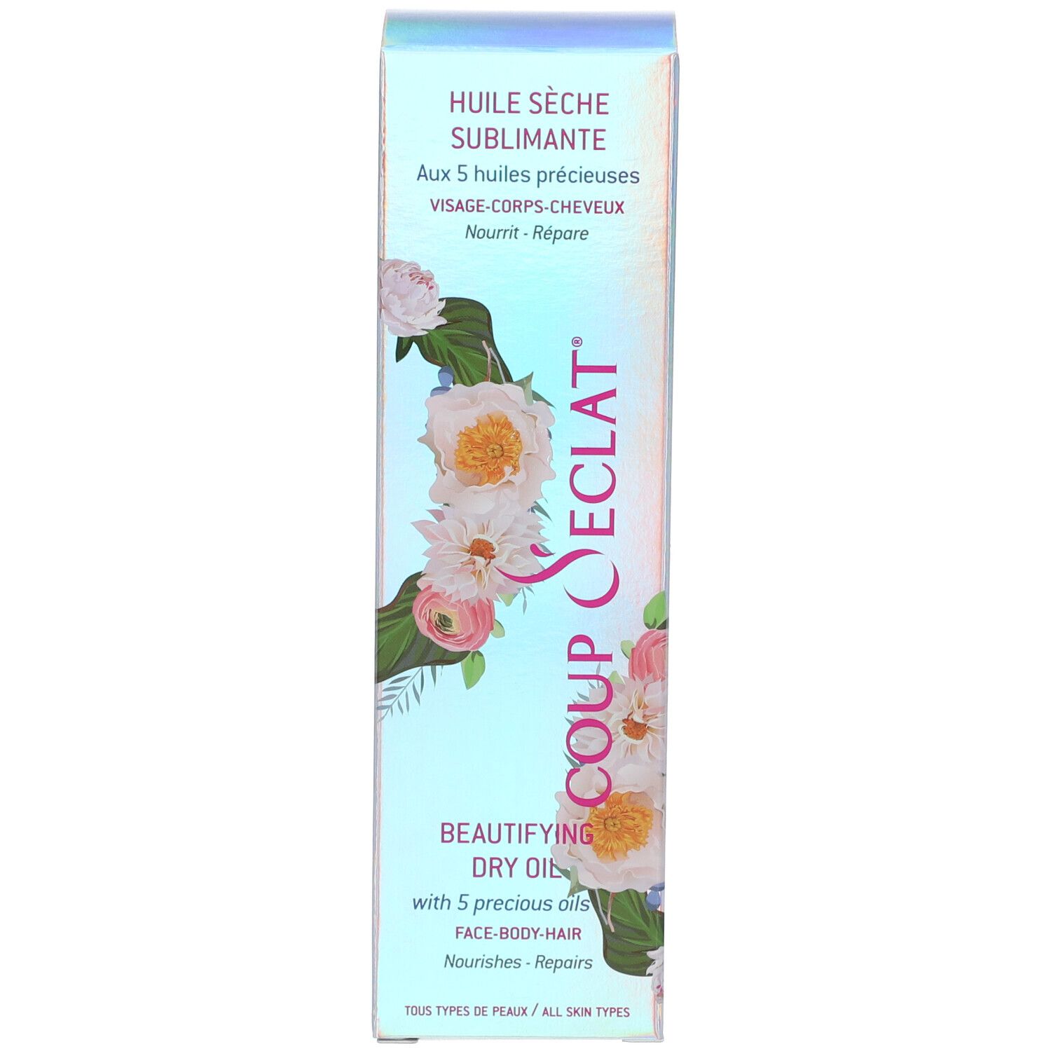 Emballage. Inscription: Coup d'Eclat, Huile Sèche Sublimante, Face-Body-Hair. Motif floral.
