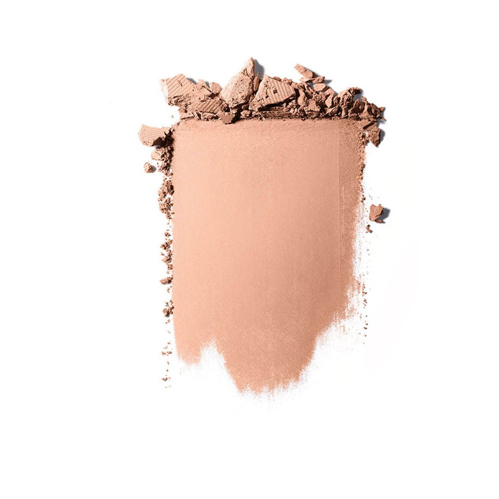 Un bloc ébréché de poudre beige clair avec des rainures visibles.
